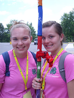 girls with tribe stick at camp